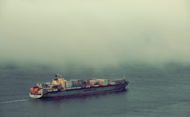 San Francisco, CA - MAY 11: Cargo ship pass by San Francisco bay in fog on May 11, 2014 in San Francisco. SF is the most densely settled large city in California and the second-most in US.